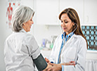Woman getting her blood pressure checked